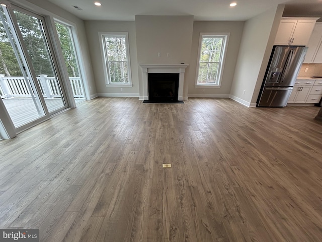 unfurnished living room with light wood-type flooring