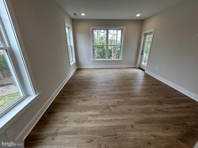 empty room with wood-type flooring