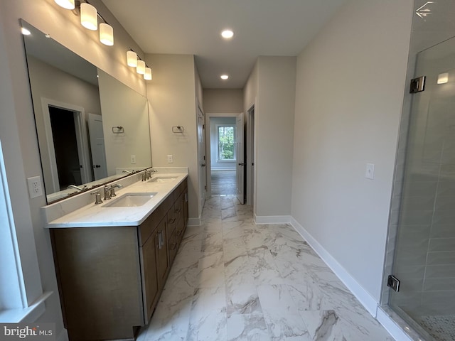 bathroom featuring walk in shower and vanity