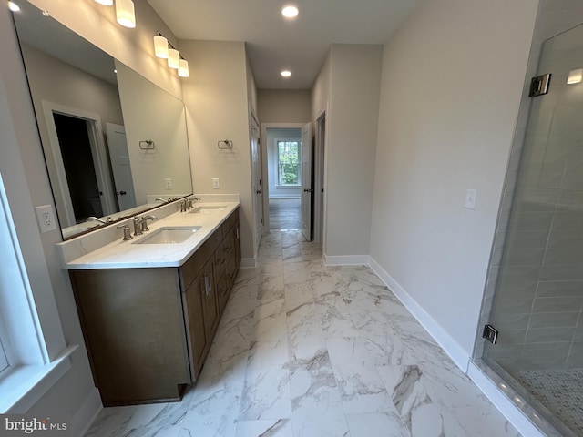 bathroom featuring vanity and an enclosed shower