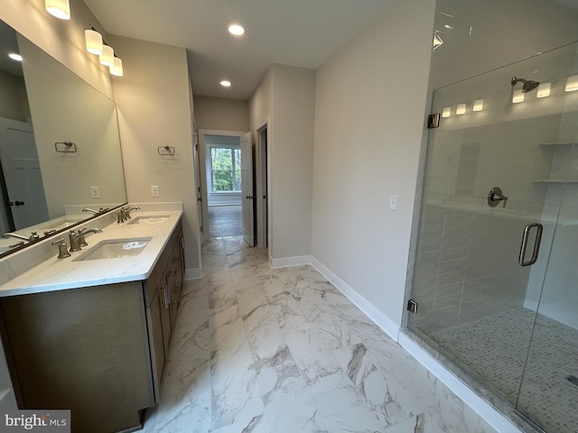 bathroom featuring walk in shower and vanity