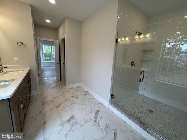 bathroom featuring vanity and a shower with door