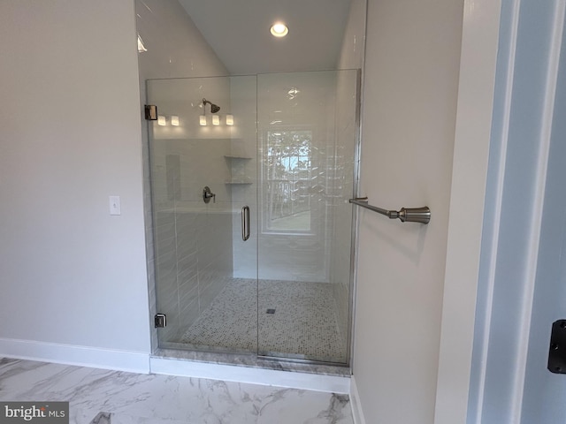 bathroom with a shower with shower door