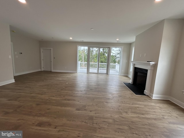 unfurnished living room featuring light wood-type flooring