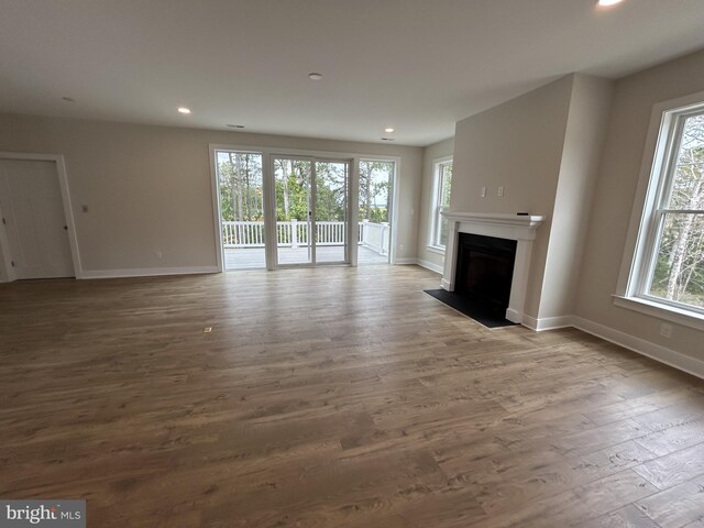 unfurnished living room with light hardwood / wood-style floors