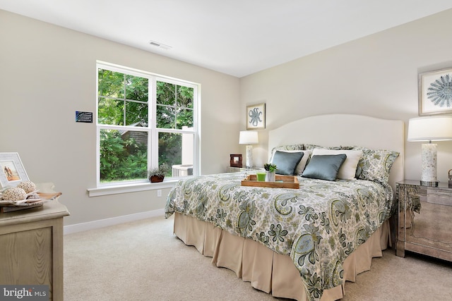 bedroom with light colored carpet