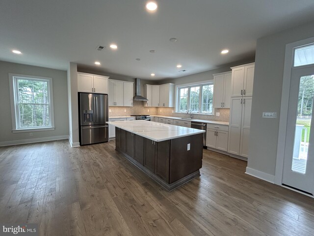 stairway with hardwood / wood-style flooring and sink