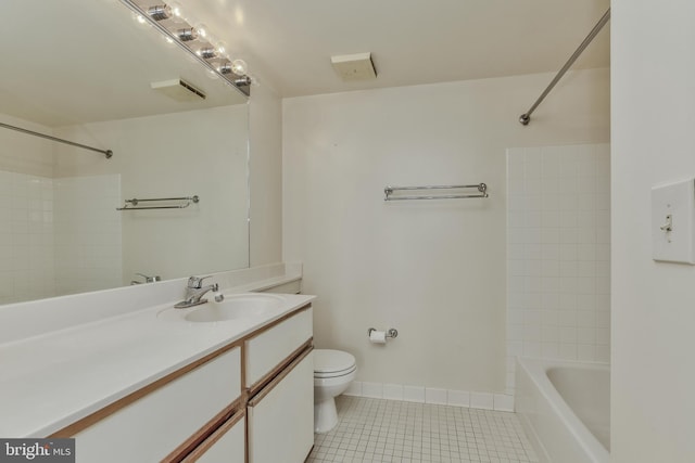 full bathroom featuring tiled shower / bath combo, tile patterned flooring, vanity, and toilet