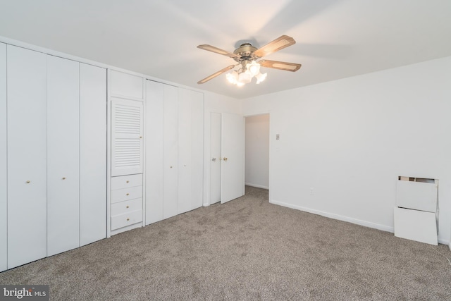 unfurnished bedroom featuring carpet and ceiling fan