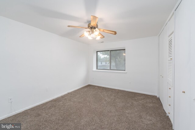 unfurnished bedroom with a closet, ceiling fan, and carpet flooring