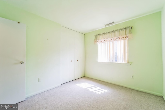 130 Slade Ave Unit 213, Pikesville, MD 21208 - unfurnished bedroom with carpet, visible vents, baseboards, and a closet