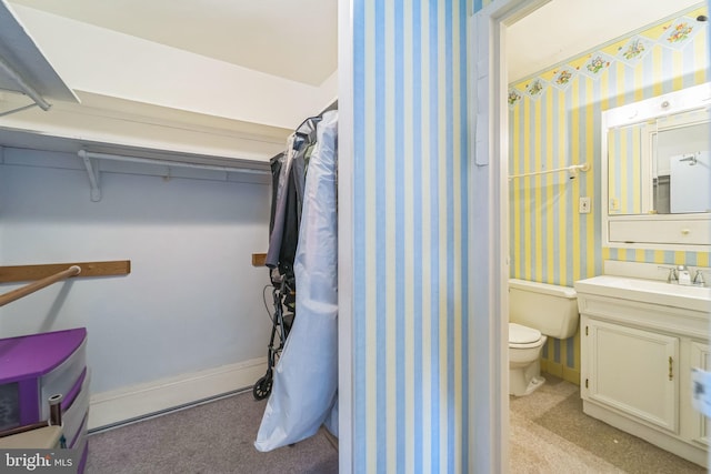 130 Slade Ave Unit 213, Pikesville, MD 21208 - bathroom with wallpapered walls, toilet, baseboards, and vanity