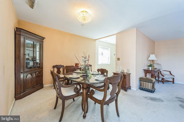 130 Slade Ave Unit 213, Pikesville, MD 21208 - dining room featuring light carpet, baseboards, and a notable chandelier