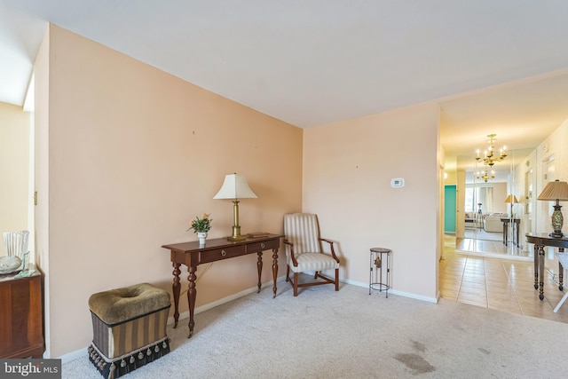 130 Slade Ave Unit 213, Pikesville, MD 21208 - living area featuring a chandelier, carpet flooring, and baseboards
