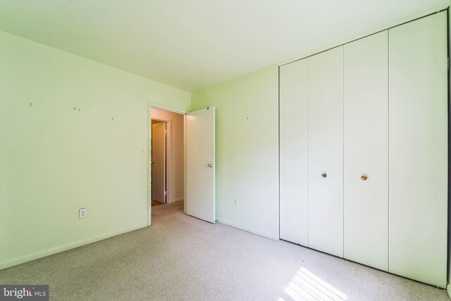130 Slade Ave Unit 213, Pikesville, MD 21208 - unfurnished bedroom with light carpet and a closet