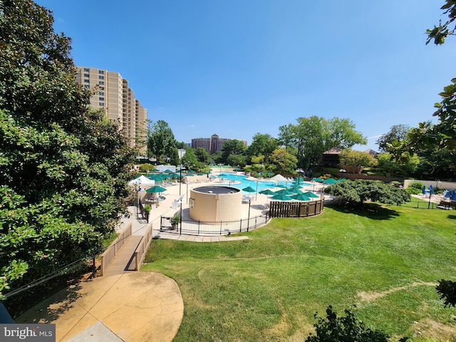 view of swimming pool with a lawn and a patio