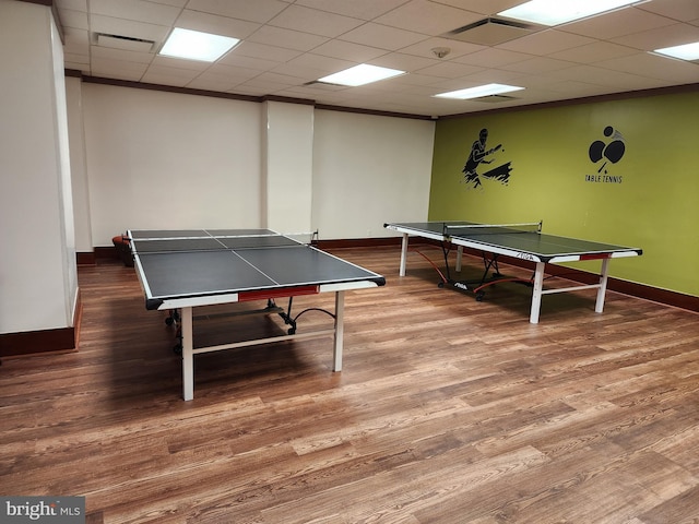 rec room featuring a paneled ceiling and hardwood / wood-style floors