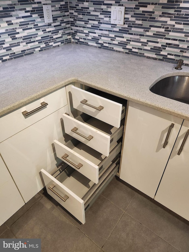 interior space with tile patterned floors and sink