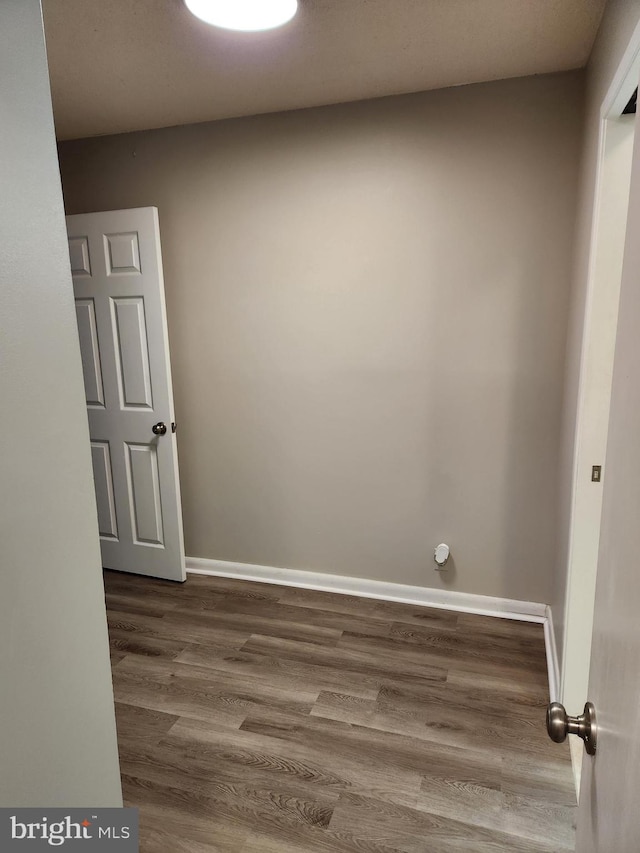 empty room with wood-type flooring