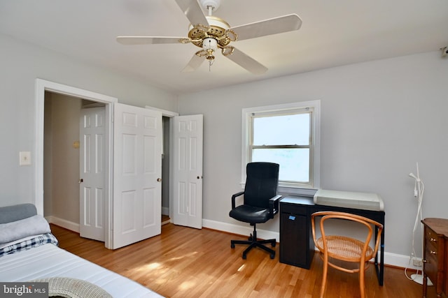 office area with ceiling fan and light hardwood / wood-style floors