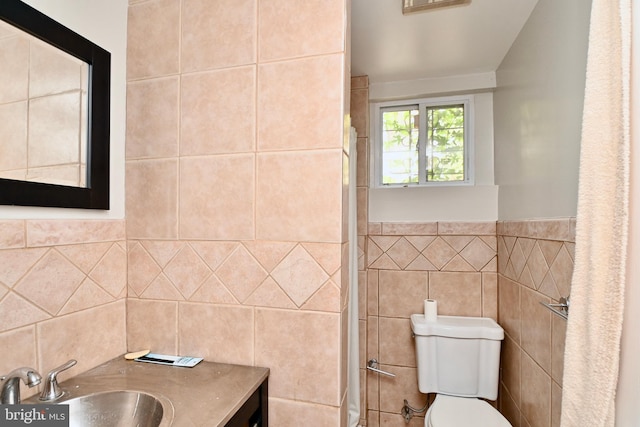 bathroom featuring tile walls, a shower with shower curtain, vanity, and toilet