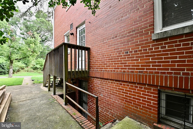 view of side of property featuring a wooden deck