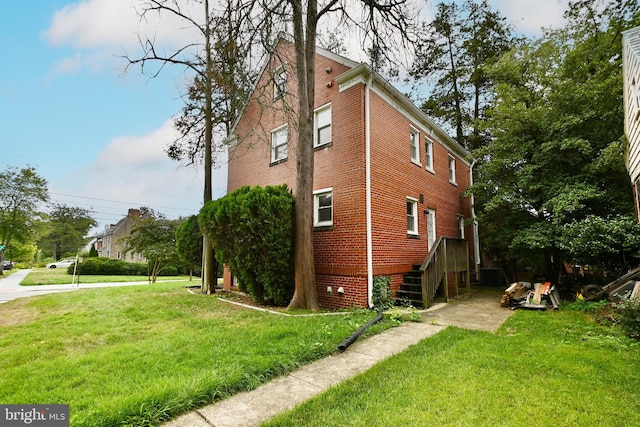 view of home's exterior with a lawn