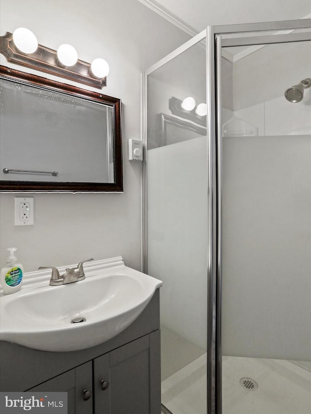 full bathroom featuring a shower stall and vanity