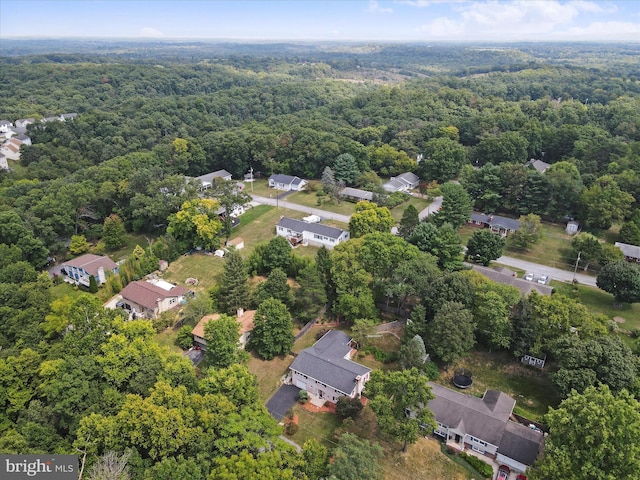 birds eye view of property featuring a residential view and a view of trees