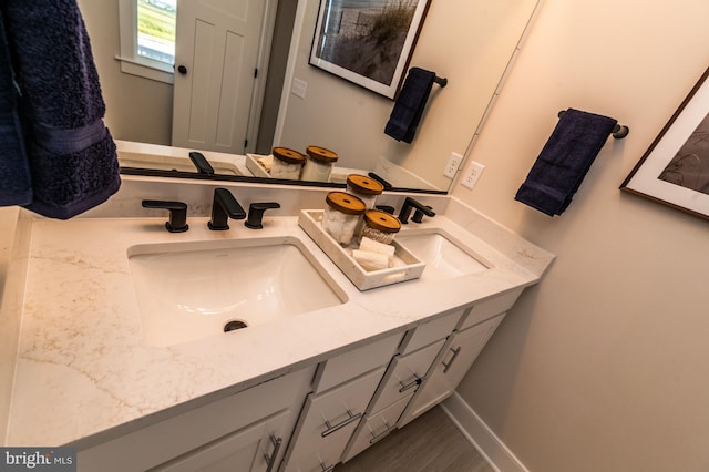 bathroom featuring vanity and hardwood / wood-style floors