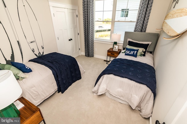 carpeted bedroom featuring a closet