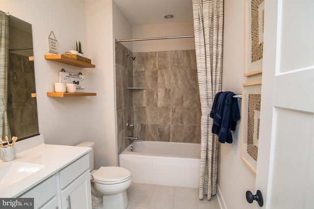 full bathroom with toilet, tiled shower / bath combo, vanity, and tile patterned floors