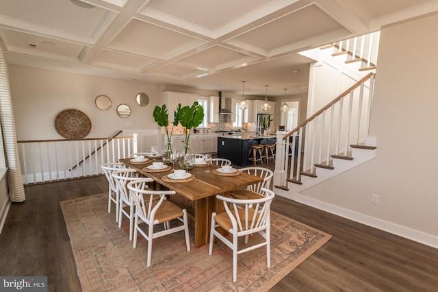 dining room featuring dark hardwood / wood-style flooring and coffered ceiling