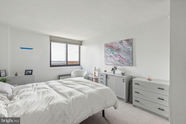 bedroom featuring light carpet