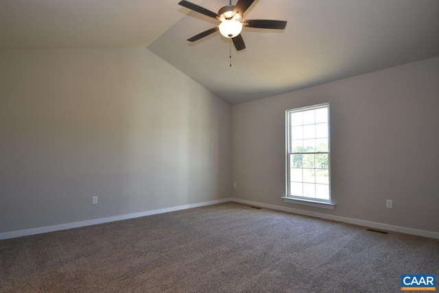 unfurnished room with carpet, vaulted ceiling, and ceiling fan