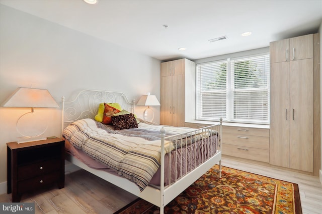 bedroom featuring light hardwood / wood-style floors