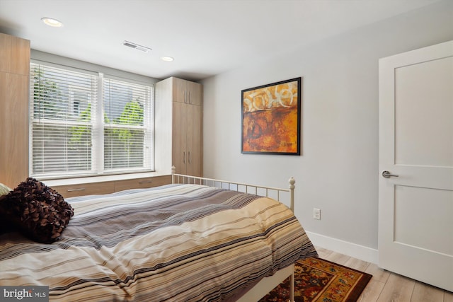 bedroom featuring light wood-type flooring