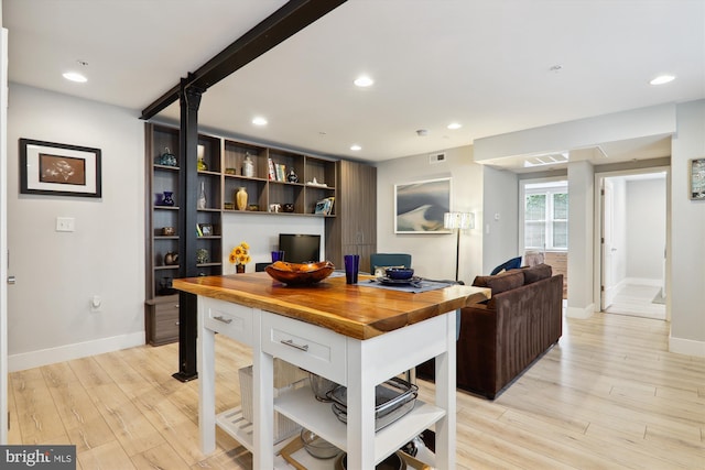 kitchen featuring light wood finished floors, open shelves, recessed lighting, white cabinets, and butcher block countertops