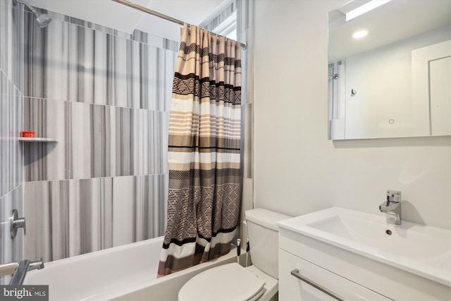 full bathroom with shower / bath combination with curtain, toilet, and vanity