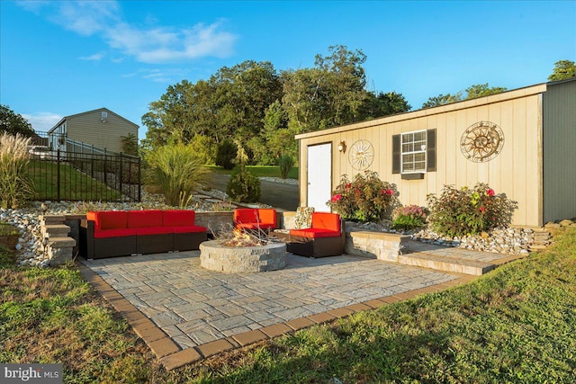 view of patio / terrace featuring an outdoor living space with a fire pit