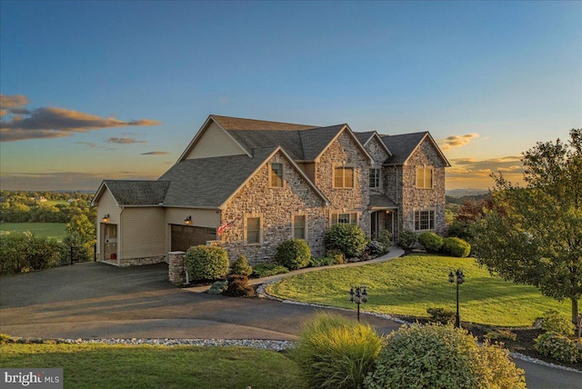 view of front of property with a yard