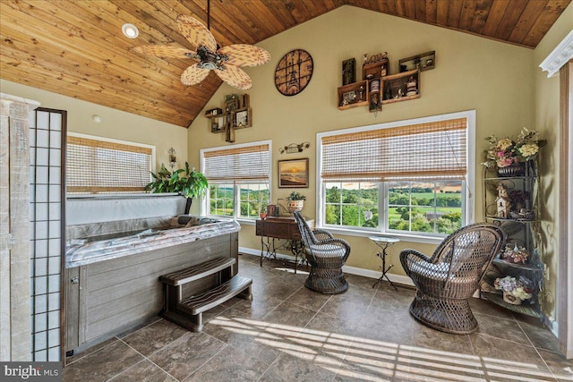 interior space featuring dark tile patterned floors, high vaulted ceiling, wooden ceiling, and ceiling fan