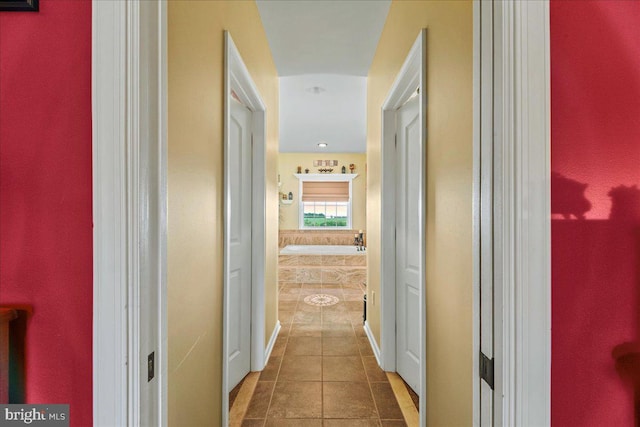 hall with tile patterned flooring