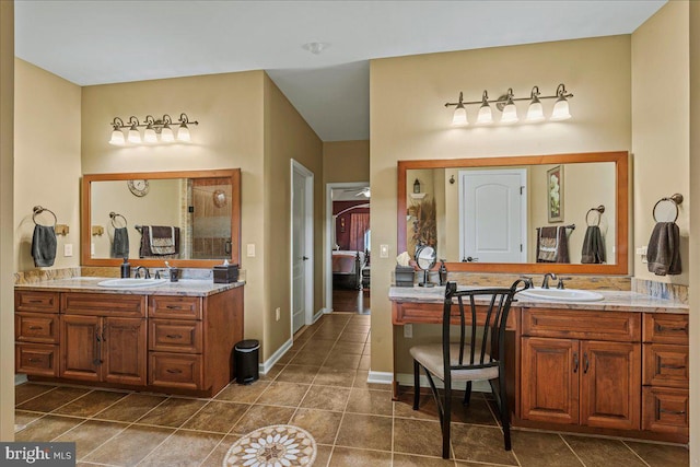 bathroom with tile patterned flooring and vanity