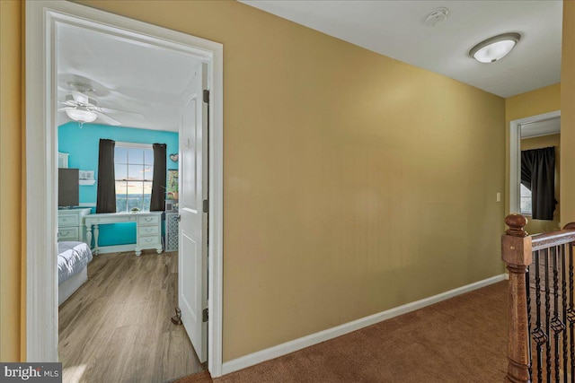 corridor with light colored carpet