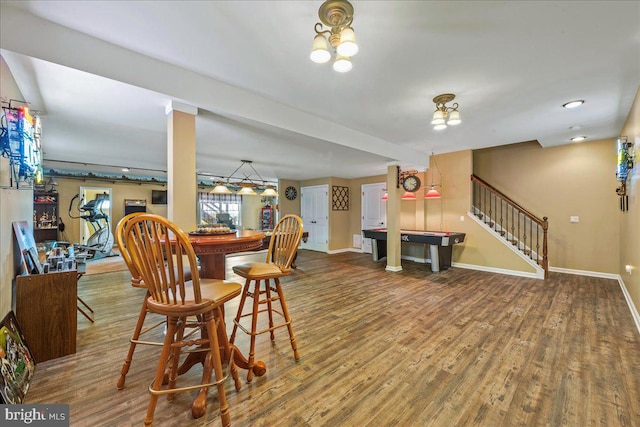 dining area with hardwood / wood-style floors and pool table