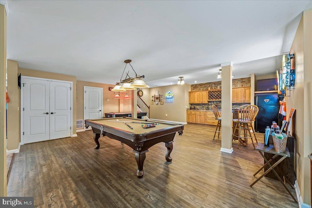 game room with pool table and hardwood / wood-style floors