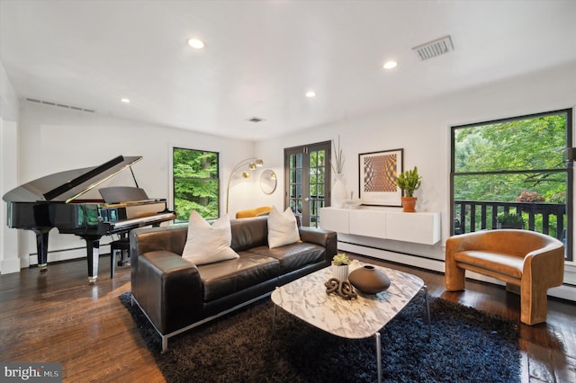 living room with dark hardwood / wood-style floors, french doors, and baseboard heating