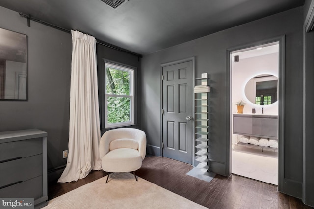 sitting room featuring dark hardwood / wood-style floors