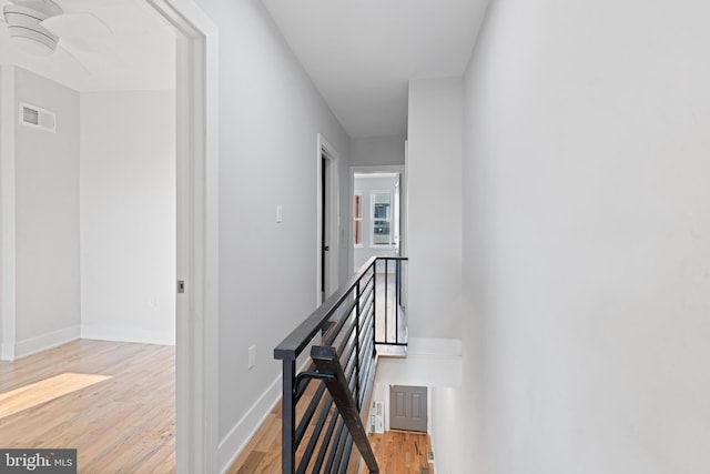 corridor featuring light hardwood / wood-style floors